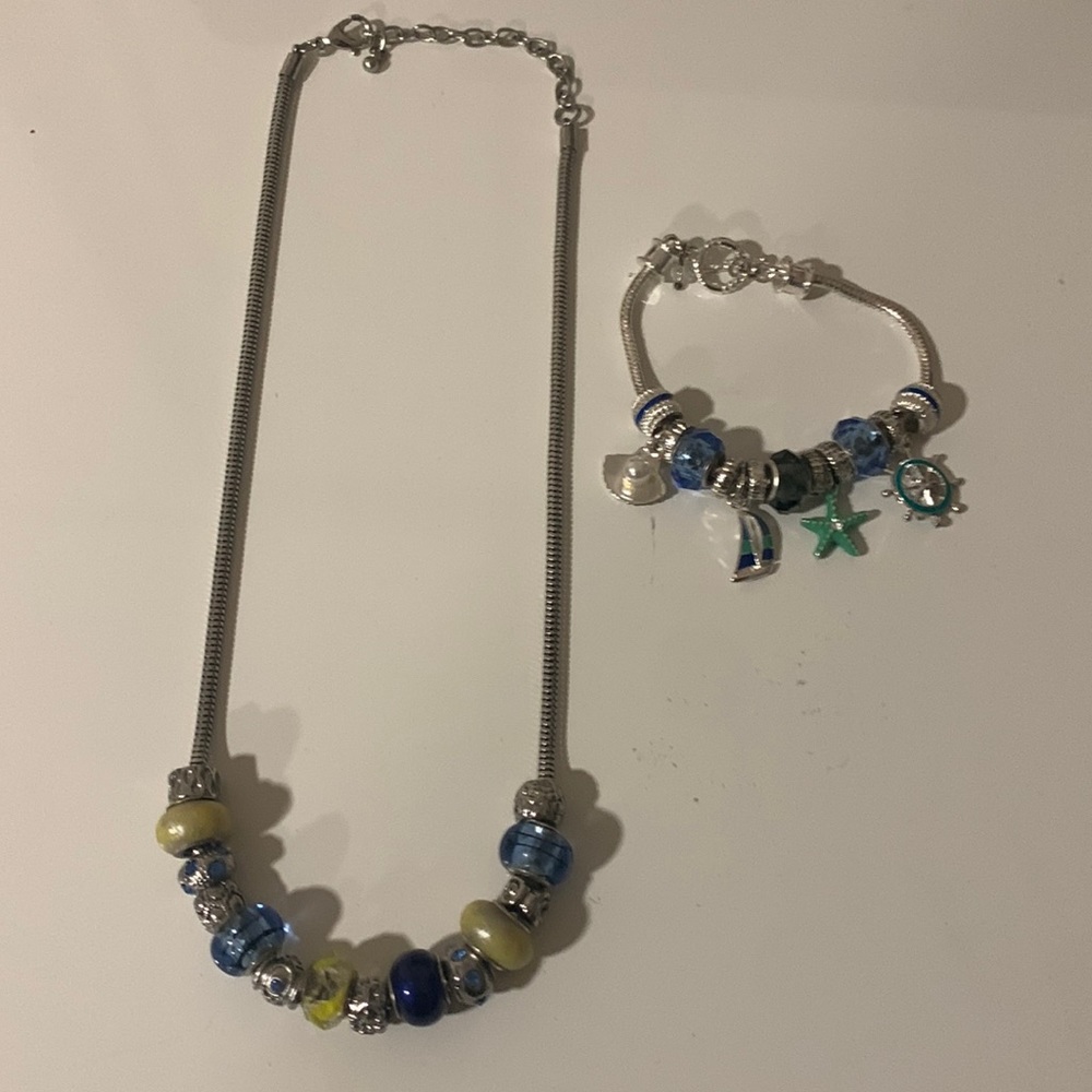 Bracelet and necklace.Silver tone.